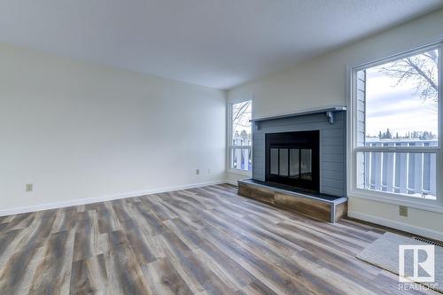 #14 4610 17 Av Nw, Edmonton, AB - Indoor Photo Showing Living Room With Fireplace