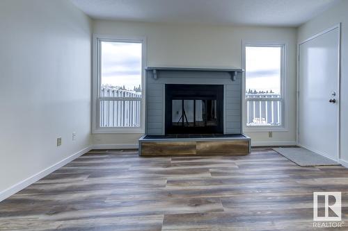 #14 4610 17 Av Nw, Edmonton, AB - Indoor Photo Showing Living Room With Fireplace