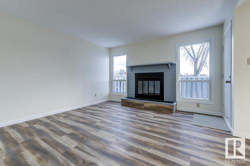 #14 4610 17 Av Nw, Edmonton, AB - Indoor Photo Showing Living Room With Fireplace