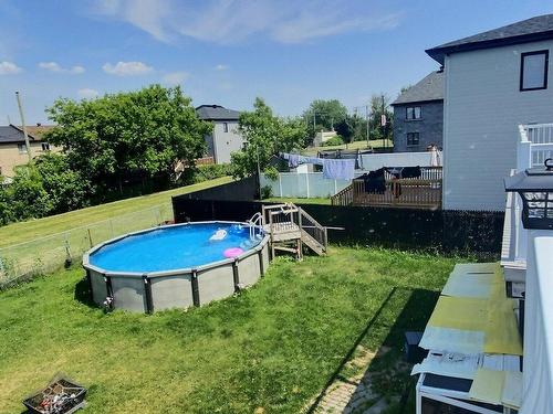 Cour - 12031  - 12037 57E Avenue (R.-D.-P.), Montréal (Rivière-Des-Prairies/Pointe-Aux-Trembles), QC - Outdoor With Above Ground Pool With Backyard