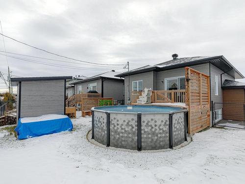 Backyard - 8815  - 8817 Rue M.-J.-Drapeau, Mirabel, QC - Outdoor With Above Ground Pool With Exterior