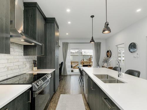 Kitchen - 8815  - 8817 Rue M.-J.-Drapeau, Mirabel, QC - Indoor Photo Showing Kitchen With Double Sink With Upgraded Kitchen