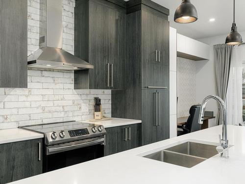 Kitchen - 8815  - 8817 Rue M.-J.-Drapeau, Mirabel, QC - Indoor Photo Showing Kitchen With Double Sink With Upgraded Kitchen