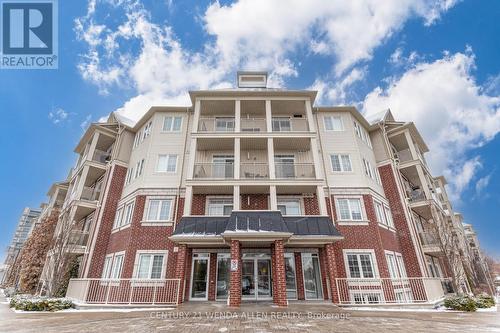 211 - 84 Aspen Springs Drive, Clarington, ON - Outdoor With Balcony With Facade