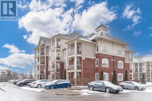 211 - 84 Aspen Springs Drive, Clarington, ON - Outdoor With Balcony With Facade