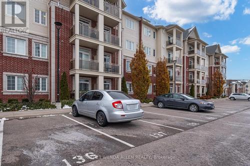 211 - 84 Aspen Springs Drive, Clarington, ON - Outdoor With Balcony With Facade