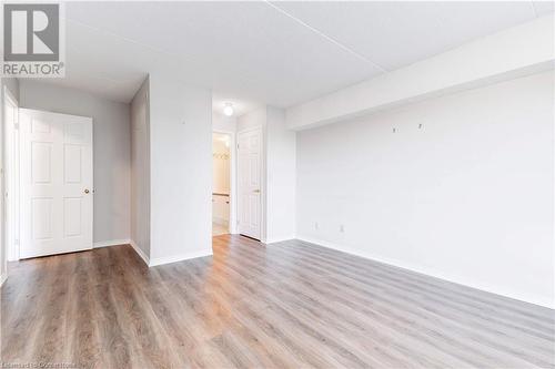 Unfurnished room with wood-type flooring - 870 Upper Wentworth Street Unit# 202, Hamilton, ON - Indoor Photo Showing Other Room