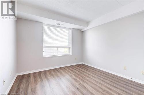 Unfurnished room with hardwood / wood-style flooring - 870 Upper Wentworth Street Unit# 202, Hamilton, ON - Indoor Photo Showing Other Room