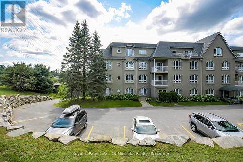 401 - 31 Dairy Lane, Huntsville (Chaffey), ON - Outdoor With Balcony With Facade