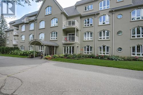 401 - 31 Dairy Lane, Huntsville (Chaffey), ON - Outdoor With Balcony With Facade