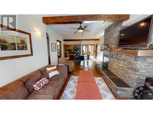 7495 Columbia Avenue Unit# 1101, Radium Hot Springs, BC - Indoor Photo Showing Living Room With Fireplace