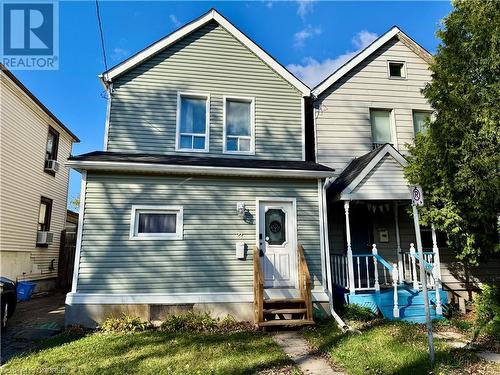 View of front of house featuring cooling unit and covered porch - 21 Minto Avenue, Hamilton, ON - Outdoor