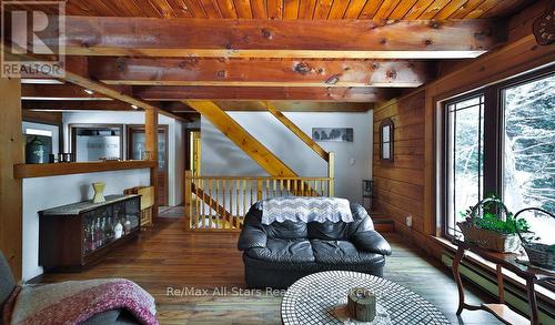 1058 Algonquin Outfitters Road, Algonquin Highlands, ON - Indoor Photo Showing Living Room With Fireplace