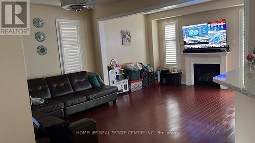 20 Whitepoppy Drive, Brampton, ON - Indoor Photo Showing Living Room With Fireplace