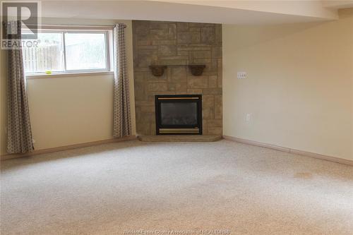 3878 Daytona, Windsor, ON - Indoor Photo Showing Living Room With Fireplace