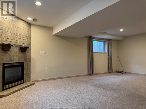 3878 Daytona, Windsor, ON - Indoor Photo Showing Basement With Fireplace