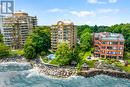 202 - 2210 Lakeshore Road, Burlington, ON  - Outdoor With Body Of Water With Facade 