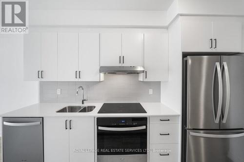 705 - 1035 Southdown Road, Mississauga, ON - Indoor Photo Showing Kitchen With Double Sink