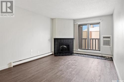 431 310 Stillwater Drive, Saskatoon, SK - Indoor Photo Showing Other Room With Fireplace