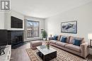 431 310 Stillwater Drive, Saskatoon, SK  - Indoor Photo Showing Living Room With Fireplace 