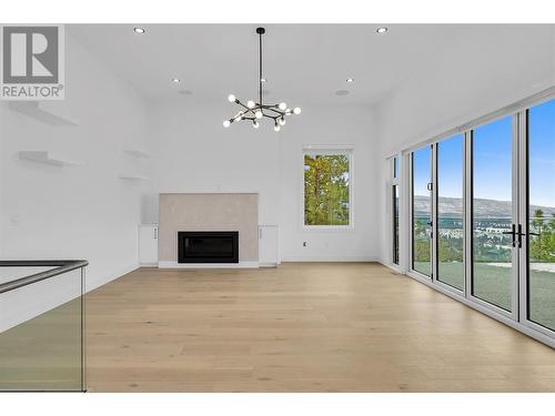 2302 Lavetta Drive, Kelowna, BC - Indoor Photo Showing Other Room With Fireplace