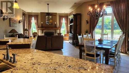 1632 County Rd 11, Stone Mills, ON - Indoor Photo Showing Dining Room With Fireplace