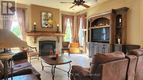 1632 County Rd 11, Stone Mills, ON - Indoor Photo Showing Living Room With Fireplace