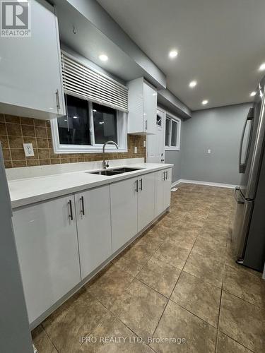 Upper - 7458 Catalpa Road, Mississauga, ON - Indoor Photo Showing Kitchen With Double Sink