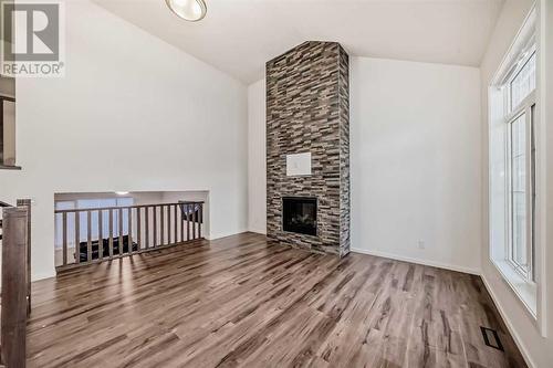 2007 Windbury Crescent Sw, Airdrie, AB - Indoor With Fireplace