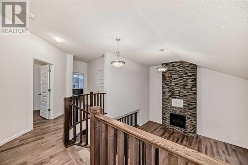 2007 Windbury Crescent Sw, Airdrie, AB - Indoor Photo Showing Other Room With Fireplace