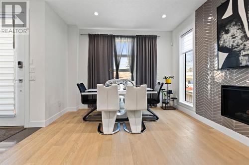 415 6 Street Ne, Calgary, AB - Indoor Photo Showing Dining Room With Fireplace