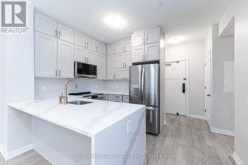 111 - 470 Gordon Krantz Avenue, Milton, ON - Indoor Photo Showing Kitchen With Stainless Steel Kitchen With Upgraded Kitchen