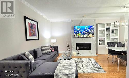 2701 - 35 Kingsbridge Garden Circle, Mississauga, ON - Indoor Photo Showing Living Room With Fireplace