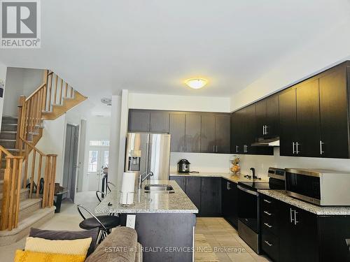 30 Povey Rd Drive, Centre Wellington, ON - Indoor Photo Showing Kitchen With Double Sink With Upgraded Kitchen