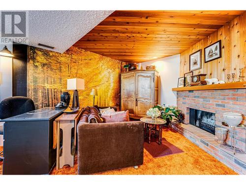 6534 Apollo Road, Vernon, BC - Indoor Photo Showing Living Room With Fireplace