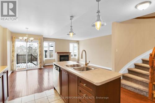 1843 Arrowgrass Way, Ottawa, ON - Indoor Photo Showing Kitchen With Fireplace With Double Sink