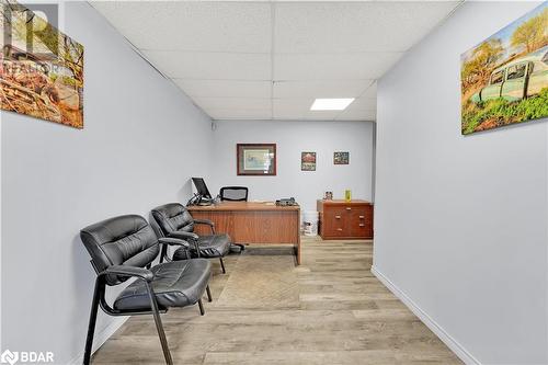 Home office with light wood-type flooring and a paneled ceiling - 8876 County Road 56, Utopia, ON 