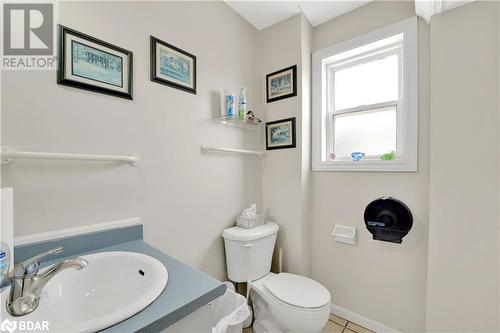 Bathroom with tile patterned flooring, vanity, and toilet - 8876 County Road 56, Utopia, ON 