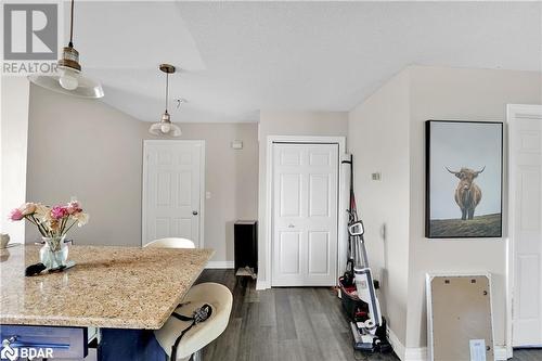 Dining room with dark hardwood / wood-style flooring - 8876 County Road 56, Utopia, ON 