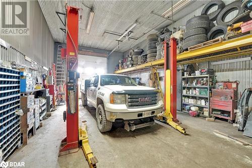 Garage featuring a workshop area - 8876 County Road 56, Utopia, ON 