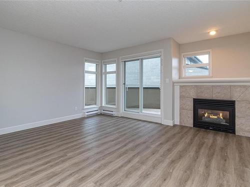 204-1258 Esquimalt Rd, Esquimalt, BC - Indoor Photo Showing Living Room With Fireplace