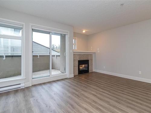 204-1258 Esquimalt Rd, Esquimalt, BC - Indoor Photo Showing Living Room With Fireplace