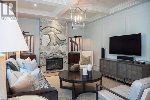 Family room with coffered ceiling and wainscotting - 304 Mcgibbon Drive, Milton, ON - Indoor With Fireplace