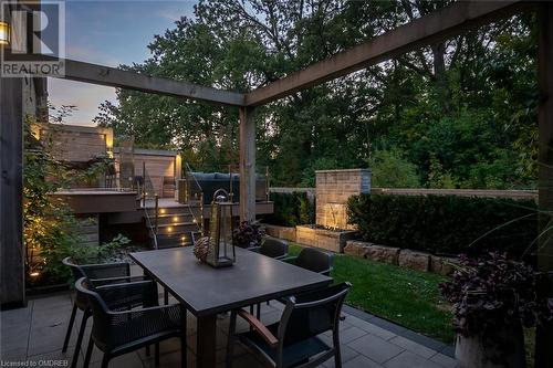 Stone dining patio overlooking green space. - 304 Mcgibbon Drive, Milton, ON - Outdoor With Deck Patio Veranda