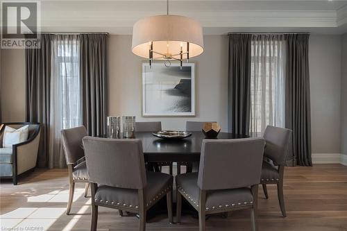 Hardwood floors, custom drapes, layered lighting. - 304 Mcgibbon Drive, Milton, ON - Indoor Photo Showing Dining Room