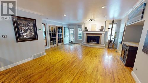 10603 104 Street, Fort St. John, BC - Indoor Photo Showing Living Room With Fireplace