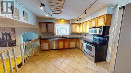 10603 104 Street, Fort St. John, BC - Indoor Photo Showing Kitchen With Double Sink