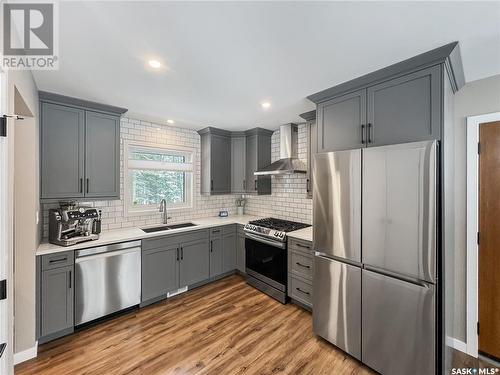 306 Meadow Ridge Drive, Candle Lake, SK - Indoor Photo Showing Kitchen With Double Sink With Upgraded Kitchen