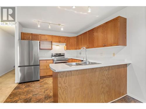 153 Snowsell Street Unit# 1, Kelowna, BC - Indoor Photo Showing Kitchen With Double Sink