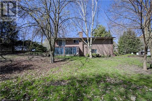 side view of home with glassed in sunroom - 345 Governors Road E, Paris, ON - Outdoor